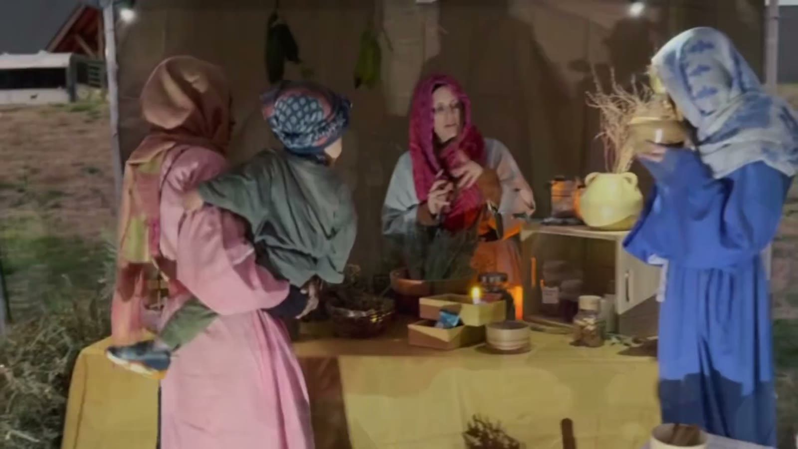Market women sell herbs and spices from wooden bowls