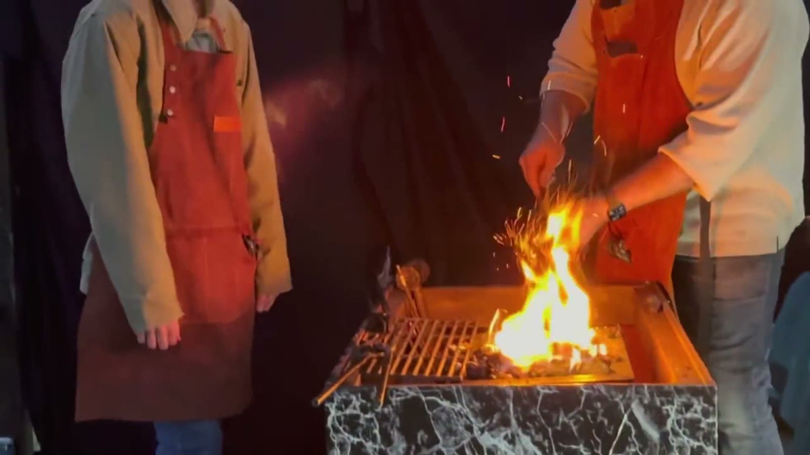 Flames leap from the blacksmith's forge